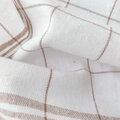 Kvalitná bavlnená utierka ANITA Hnedá v bielo-hnedom károvanom prevedení. 
