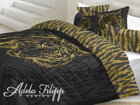 Makosaténové obliečky s potlačou zlatého tigra na čiernom podklade.