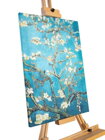 Obraz na plátne od slávneho maliara Vincenta van Gogha - Blossom Almond. Biele kvety stromu vo víre jari, obklopené hlbokou a nekonečnou modrou oblohou. 